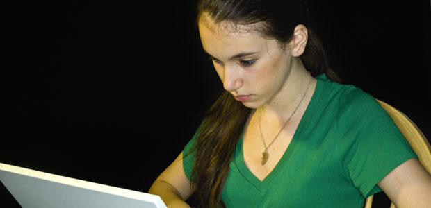 The online ZAPS ACT-Practice Test will help prepare you with extra practice on a full-length test. A teenage girl uses her laptop; she is very focused.
