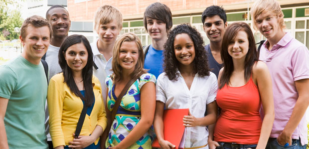 ZAPS has helped more than 200,000 students prepare for college. A diverse group of teens stands outside their high school