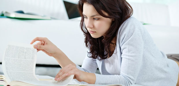 ZAPS helps take the anxiety out of preparing for college entrance exams. A teenage girl studies while lying on the floor